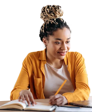 A young woman in a mustard-yellow sweater smiling while working.